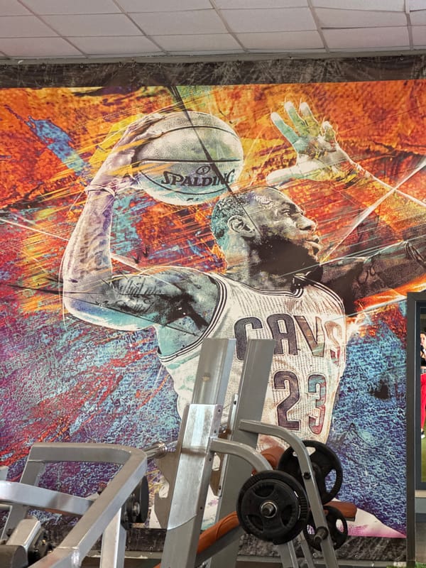 Basketball poster spotted near gym equipment in Russian town