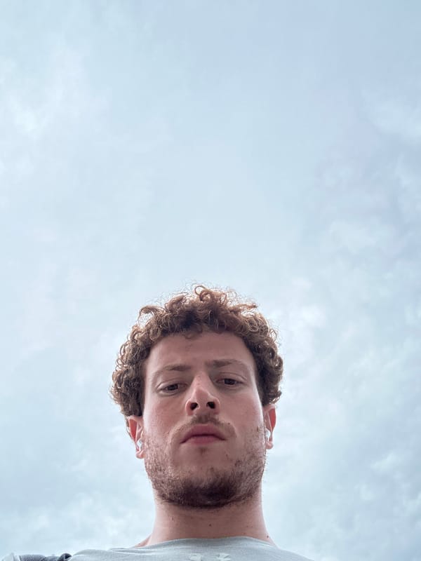 Person with earbuds photographed in close-up in New York