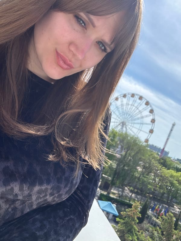 Woman takes morning selfies at Yevpatoriya amusement park