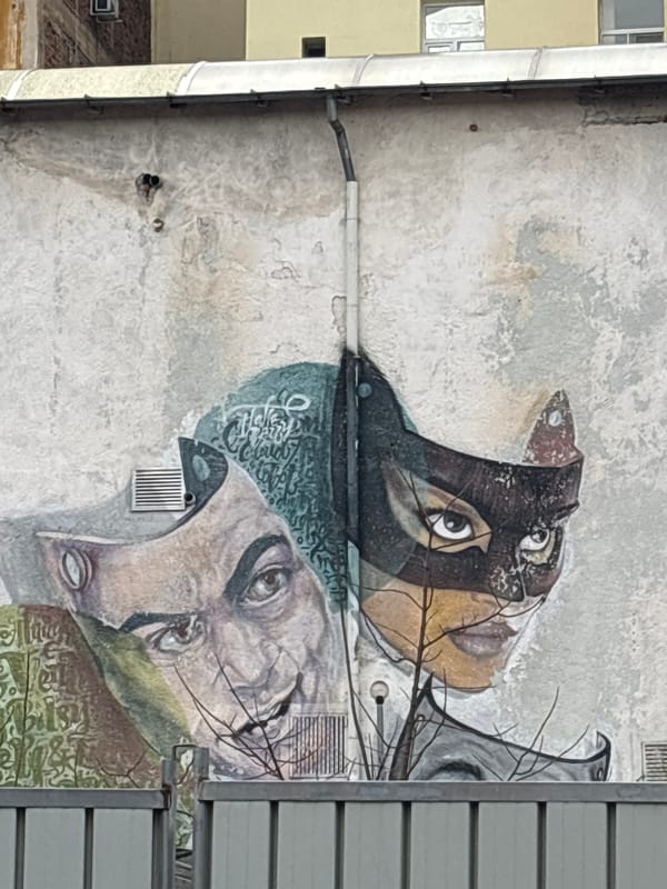 Orange cat rests on building ductwork in Stara Zagora