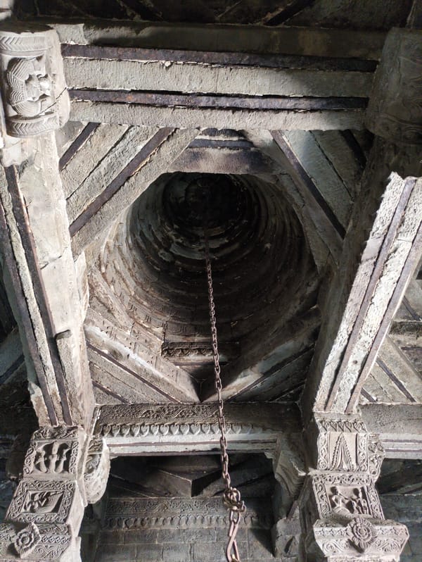 Stone temple interior with deity statues and ceremonial bull sculpture