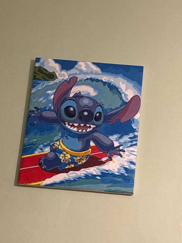 Person resting indoors with Disney decor captured in Russia