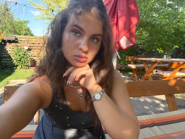 Woman enjoys outdoor lunch in Bulgarian village garden