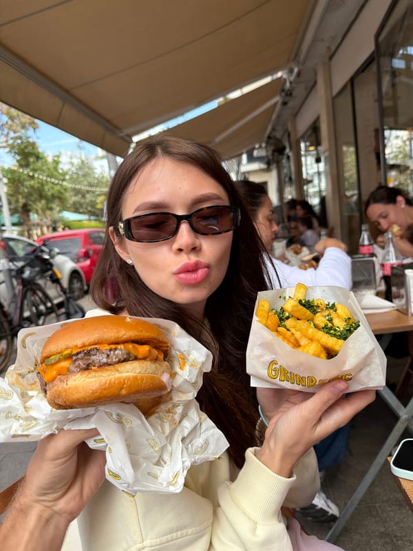 Woman enjoys outdoor lunch at Tel-Aviv restaurant