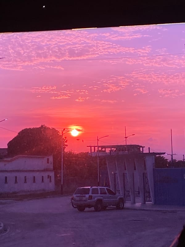 Sunset observed over Higuerote, Venezuela street scene