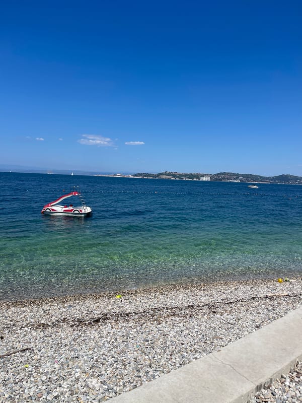 Beach resort day in Crveni Vrh, inflatables out, drinks poured
