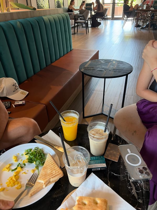 Brunch and phone time at Milan cafe