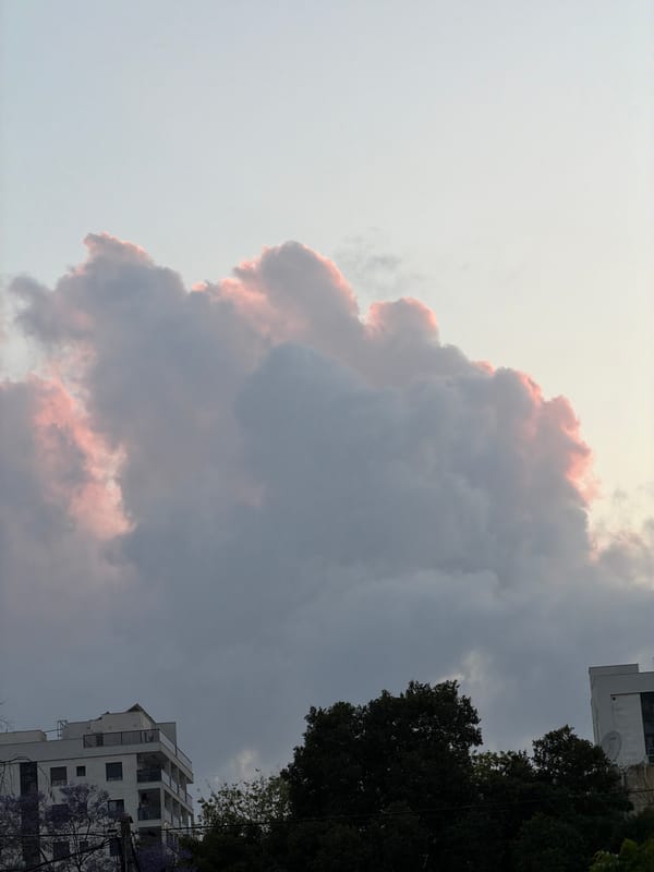 Pink-edged cumulus cloud observed over Kiryat Bialik, Israel