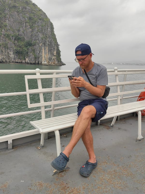 Ferry passenger documents scenic boat journey in Vietnam waters