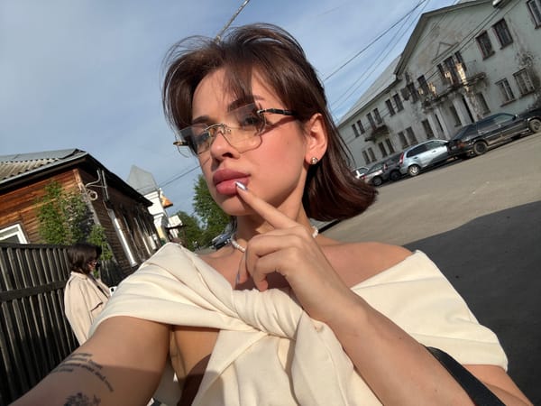 Woman poses for street photos in Sarapul, Russia