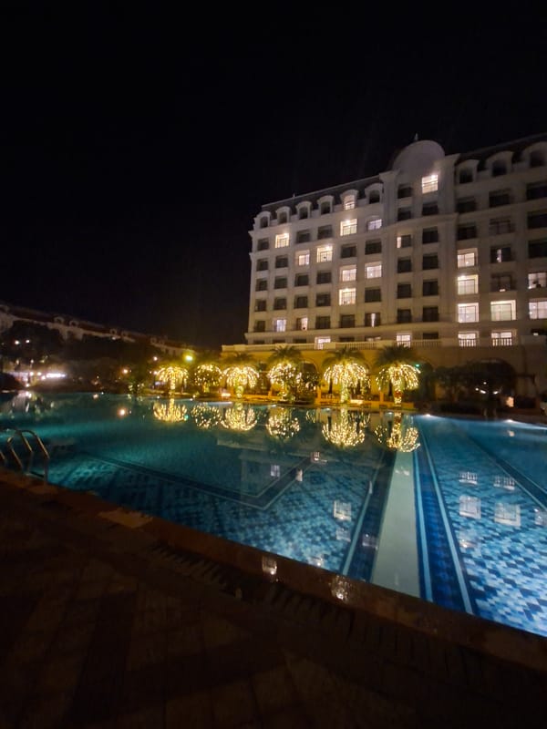 Nighttime hotel pool and facade, multiple angles