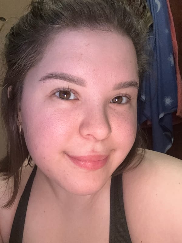 Woman photographed smiling in casual indoor moment in Kazan