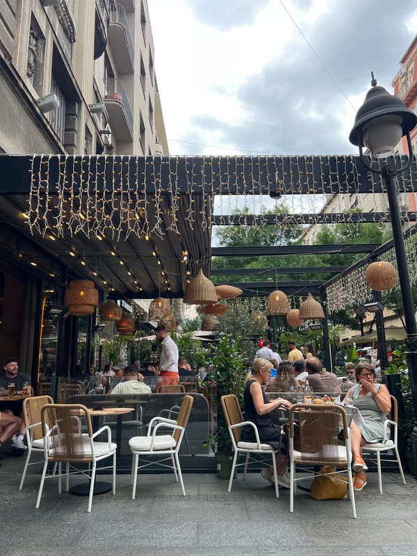 Outdoor cafe dining captured in Belgrade during afternoon hours