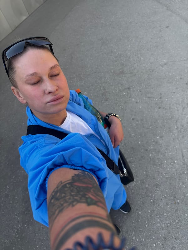 Person takes selfie on pavement in Perm, Russia