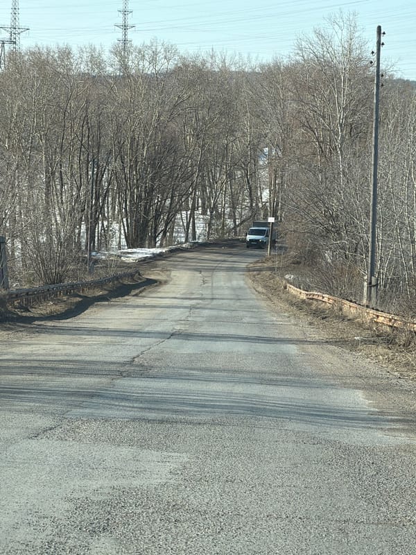 Cracked rural road documented in Chaikovsky outskirts