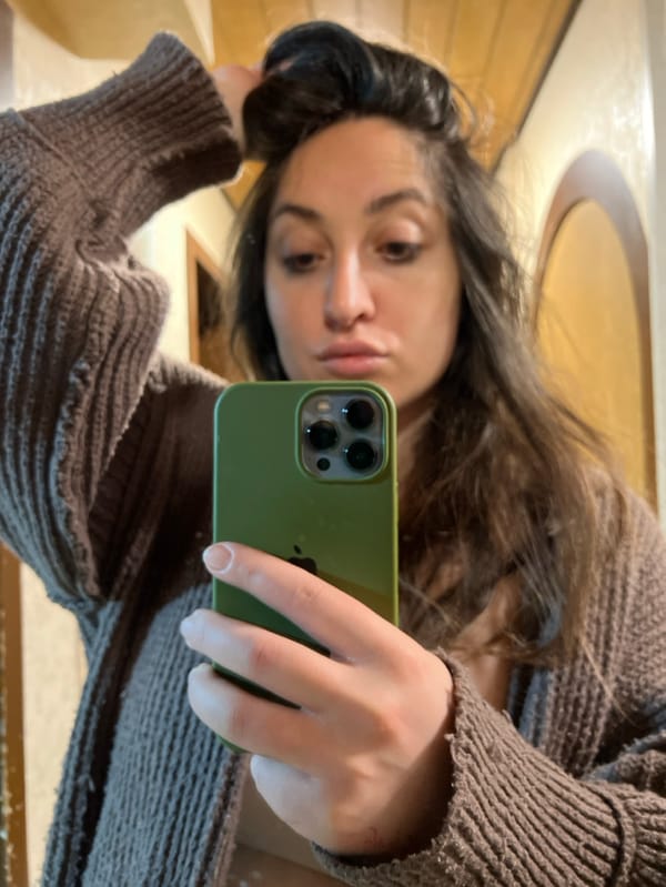 Woman takes morning selfies while grinding coffee in Wüstenrot