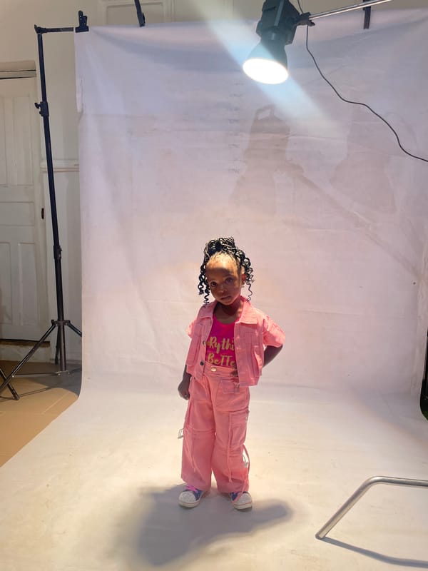 Girl poses for professional portrait session in Jos studio