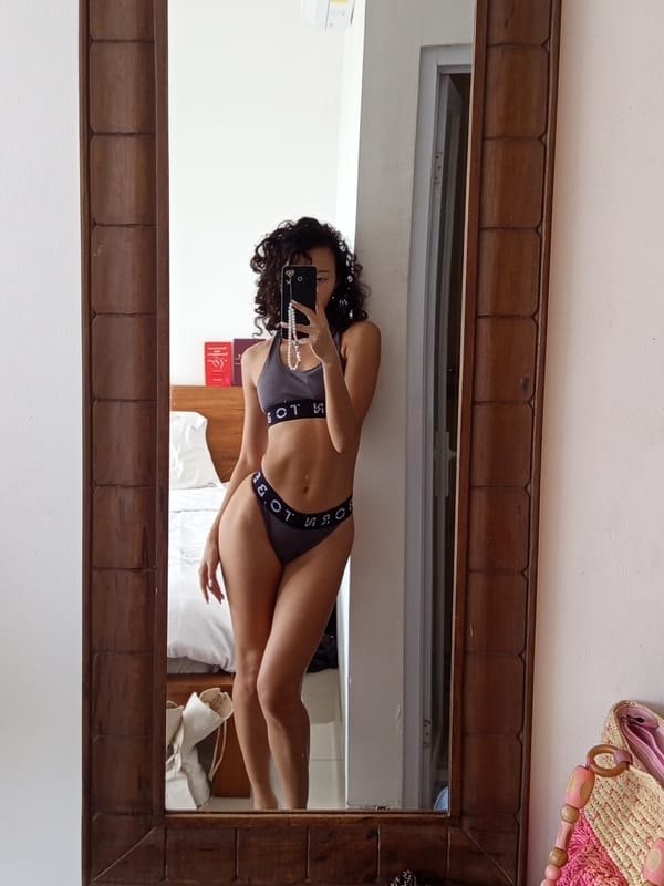 Person Takes Mirror Selfie in Gray Athletic Wear