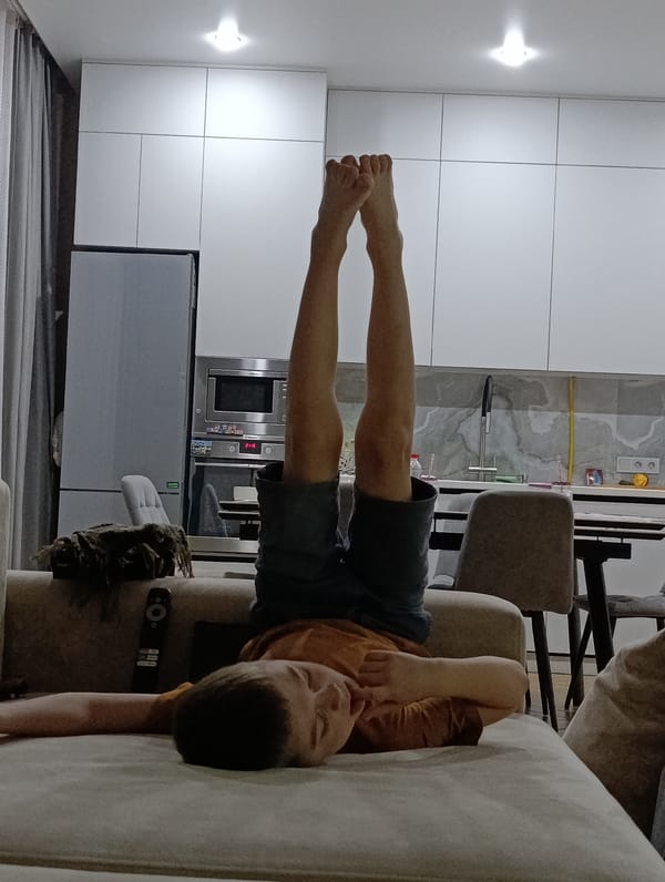 Boy relaxes on couch at home in Chaikovsky