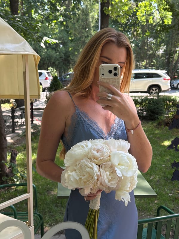 Woman documents flower bouquet selfies across Bishkek locations