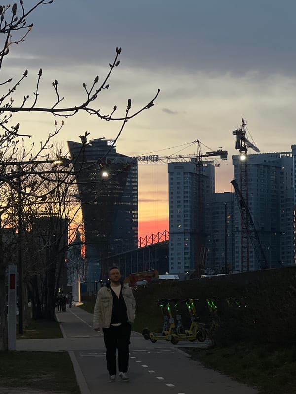 Person observed on Moscow sidewalk during sunset amid construction