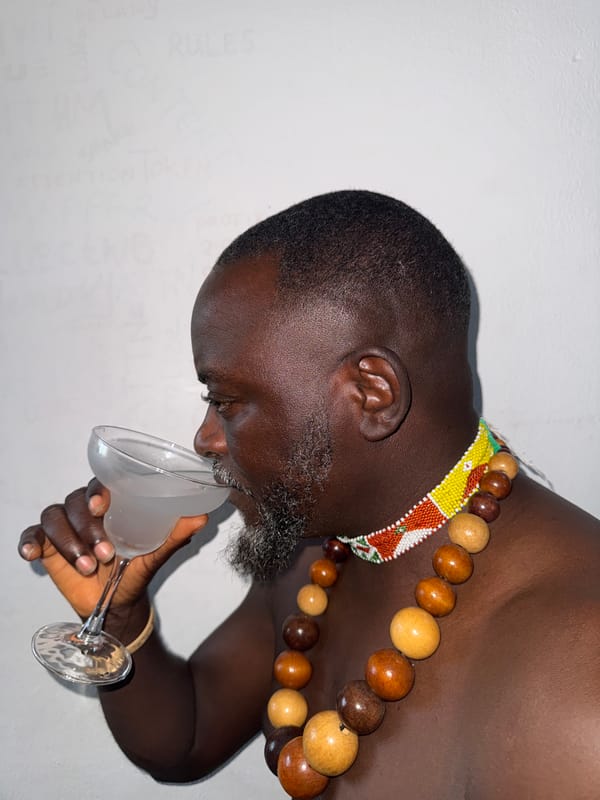 Man drinks from glass in Ado, Nigeria