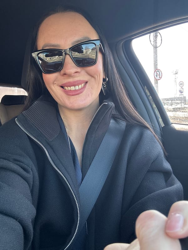 Woman takes morning selfie in car in Chaikovsky