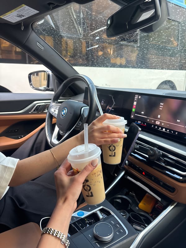 Coffee break captured in BMW interior, Yerevan Armenia