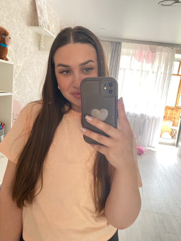 Woman takes morning selfies at home in Chaikovsky