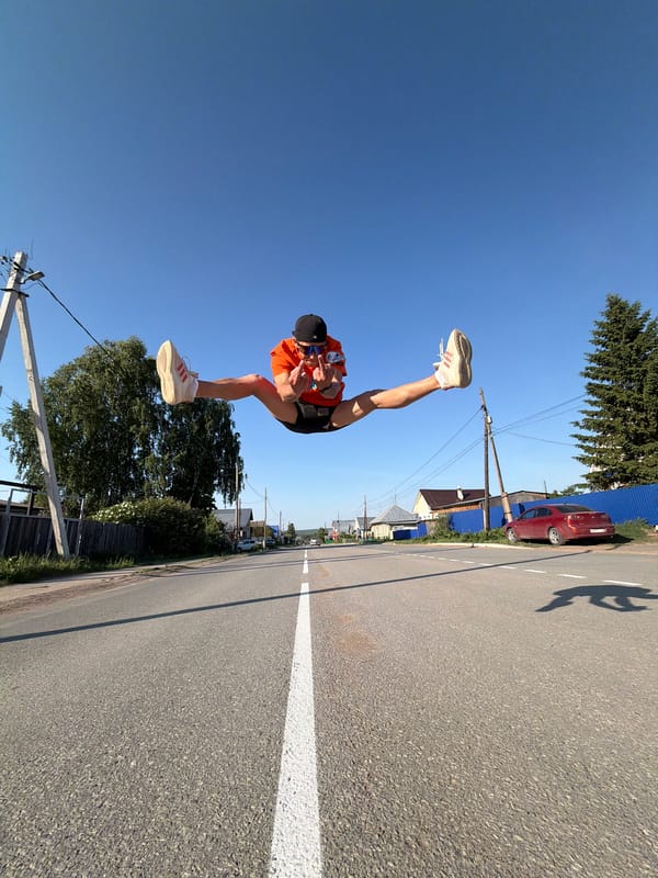 Man performs aerial split jump on Chaikovsky street