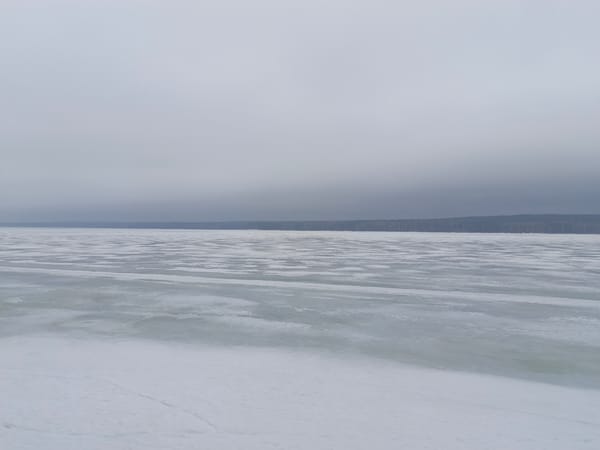 Man visits chess tables at frozen lakeside park in Russia