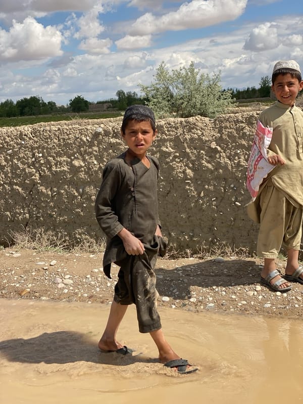 Children in traditional dress spotted in Afghan village