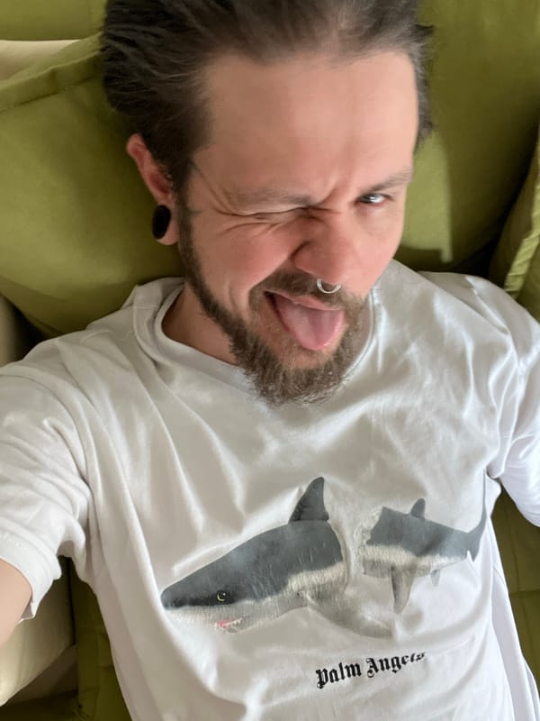 Man makes playful face on sofa in Montenegro