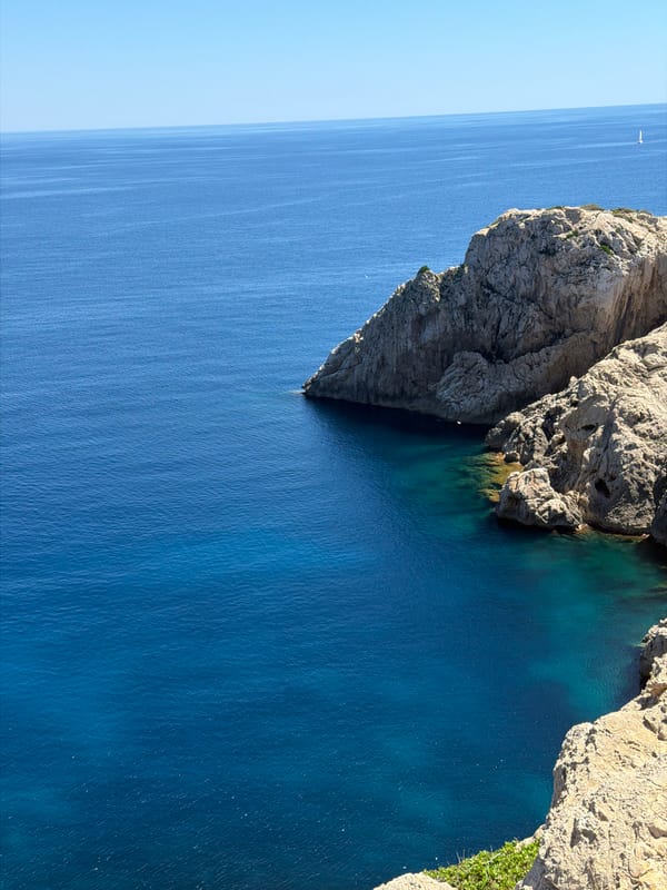 Tourists capture Mediterranean coastal scenes at Spanish seaside locations