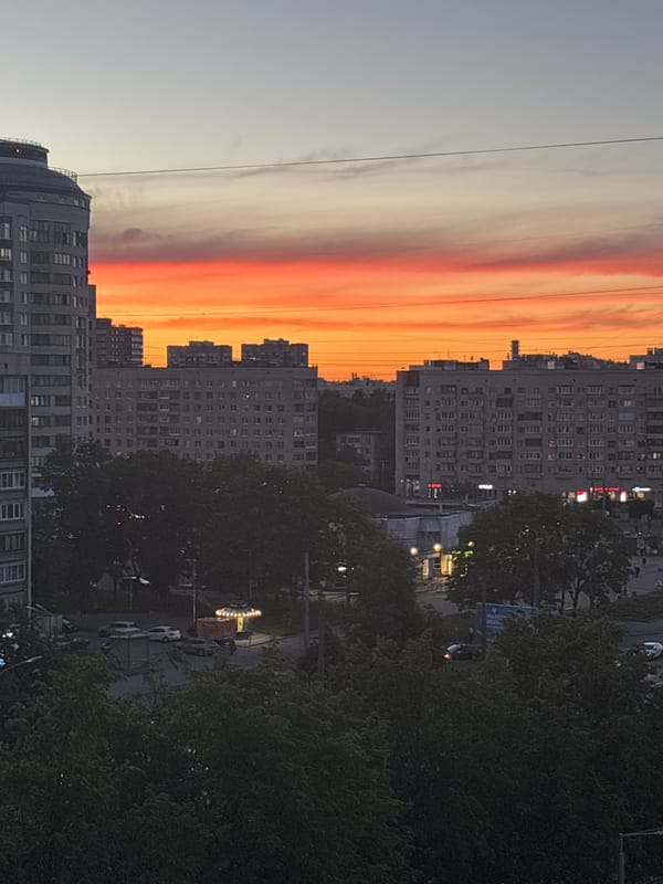 Dramatic sunset illuminates Russian lakeside city skyline