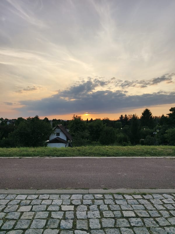 Summer sunset over Tczew, from fields to river bridge