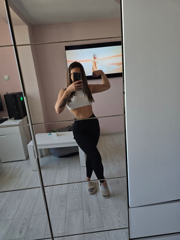 Woman poses for indoor photograph in Burgas, Bulgaria