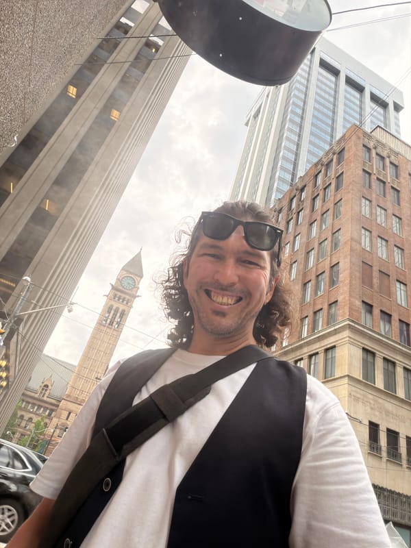 Street selfie in Toronto, low-angle wide shot