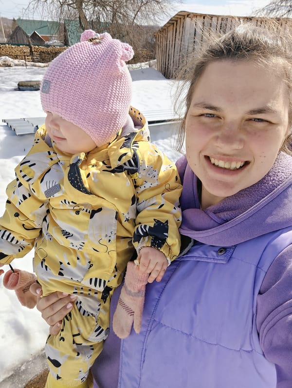 Family life documented in Russian village during spring morning