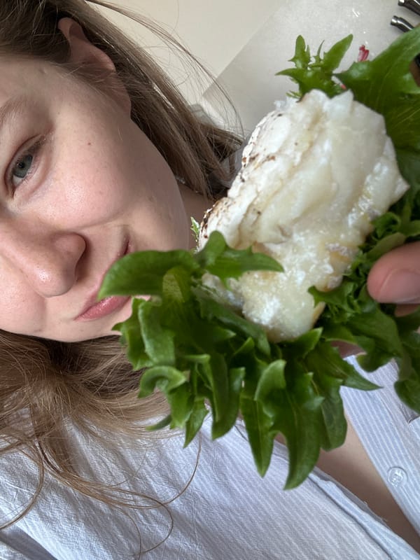 Person poses with sandwich in Kazan