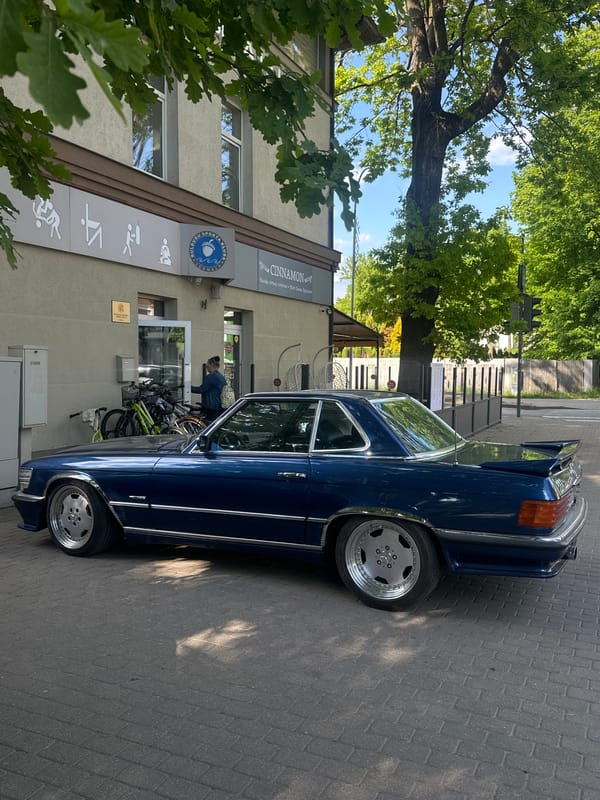 Classic cars gather on brick street in Jūrmala, Latvia