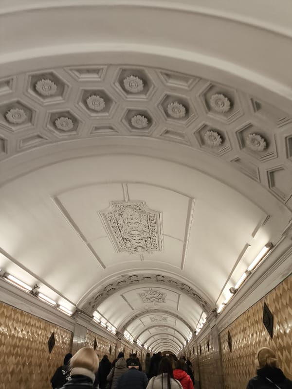 Ornate subway station with bronze statues documented alongside domestic scenes