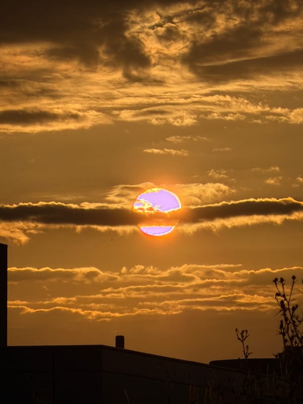 Golden sunset over Leudelange's industrial outskirts