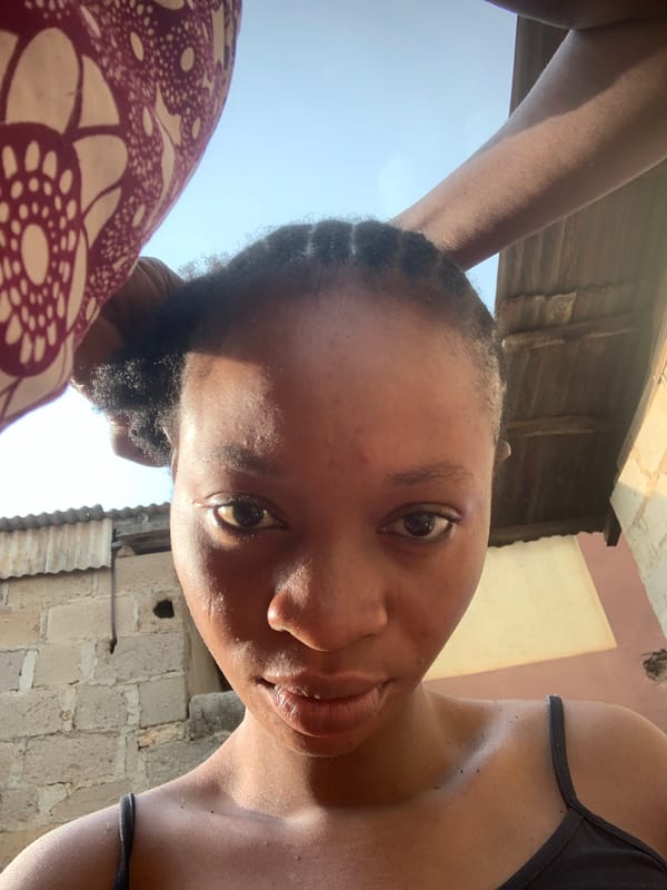 Morning in a Shagamu courtyard: hair braiding, cooking, casual selfies