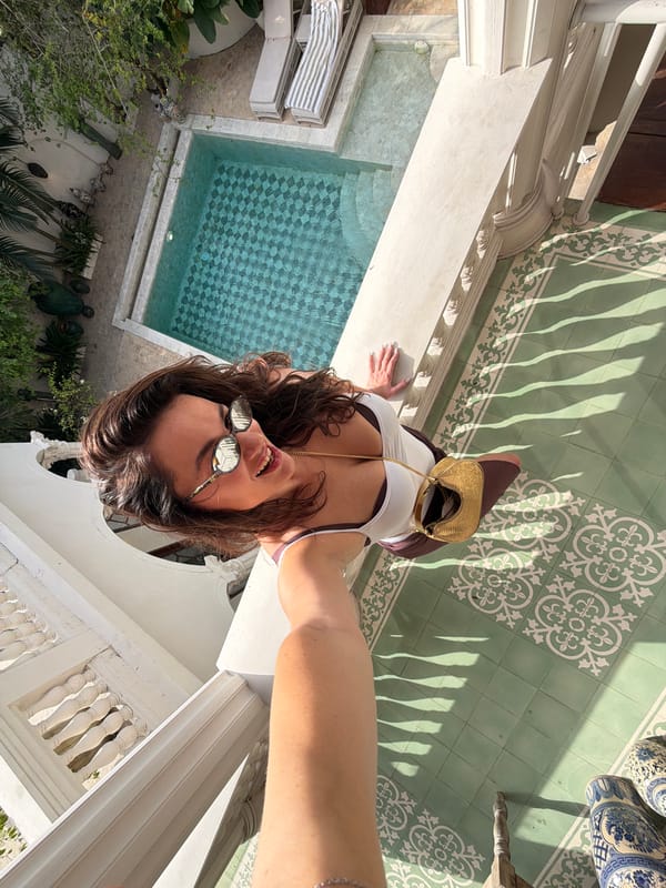 Woman takes selfies from elevated spot in North Kuta
