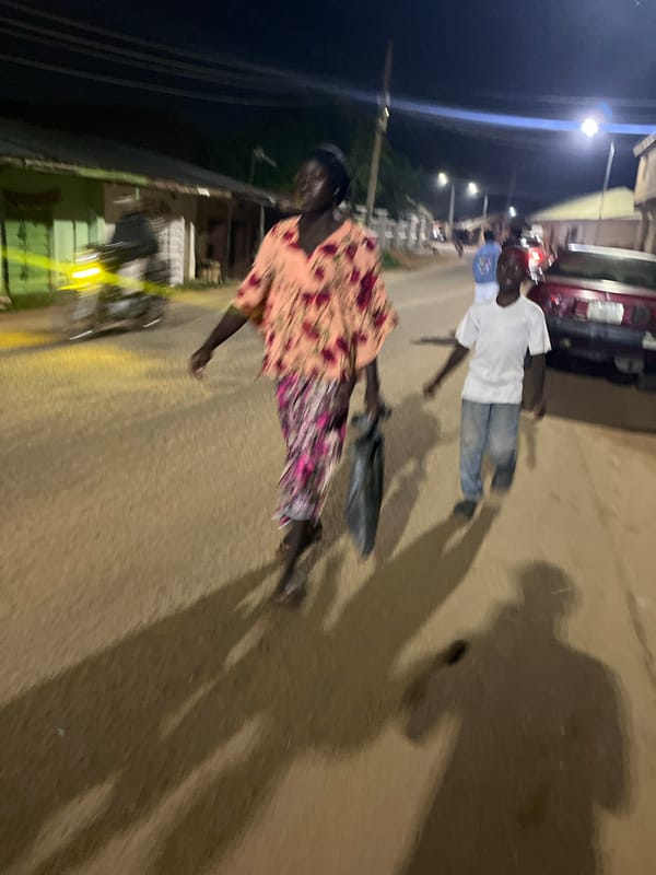 Nighttime street life near a small shop in Gura Top, Nigeria