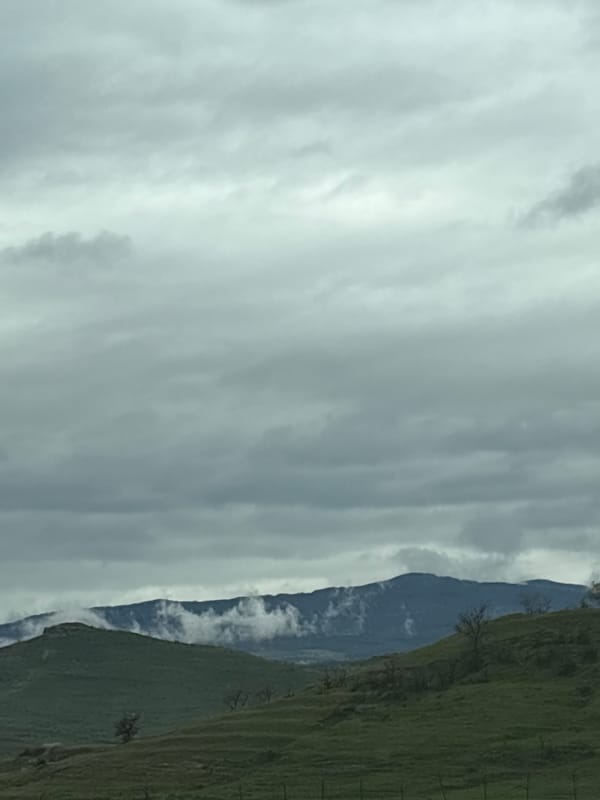 Mountain range viewed through clouds near Levunovo, Bulgaria