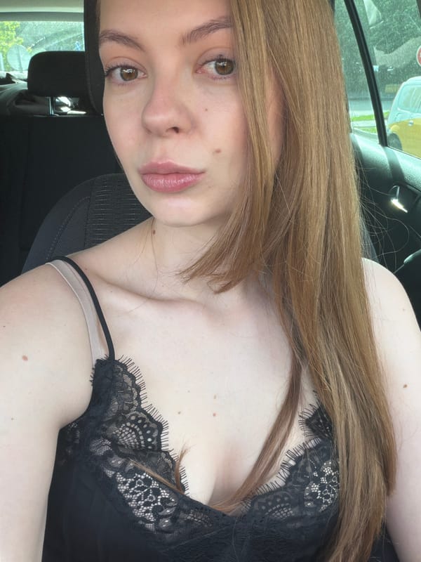 Woman photographed in car interior in Khimki, Russia