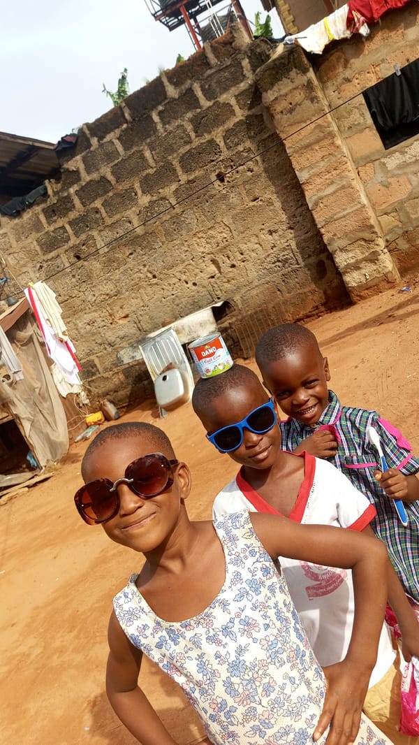 Children play and pose in everyday moments across Nkpor, Nigeria