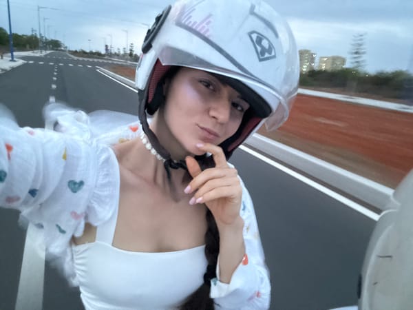 Woman in motorcycle helmet photographed in Mui Ne, Vietnam